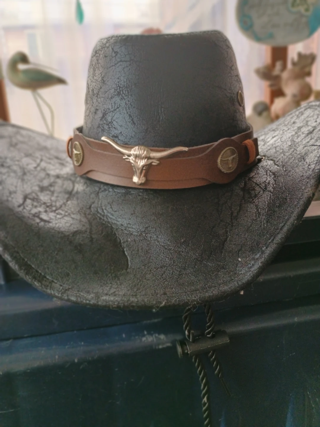 Black faux leather cowboy hat with longhorn detail
