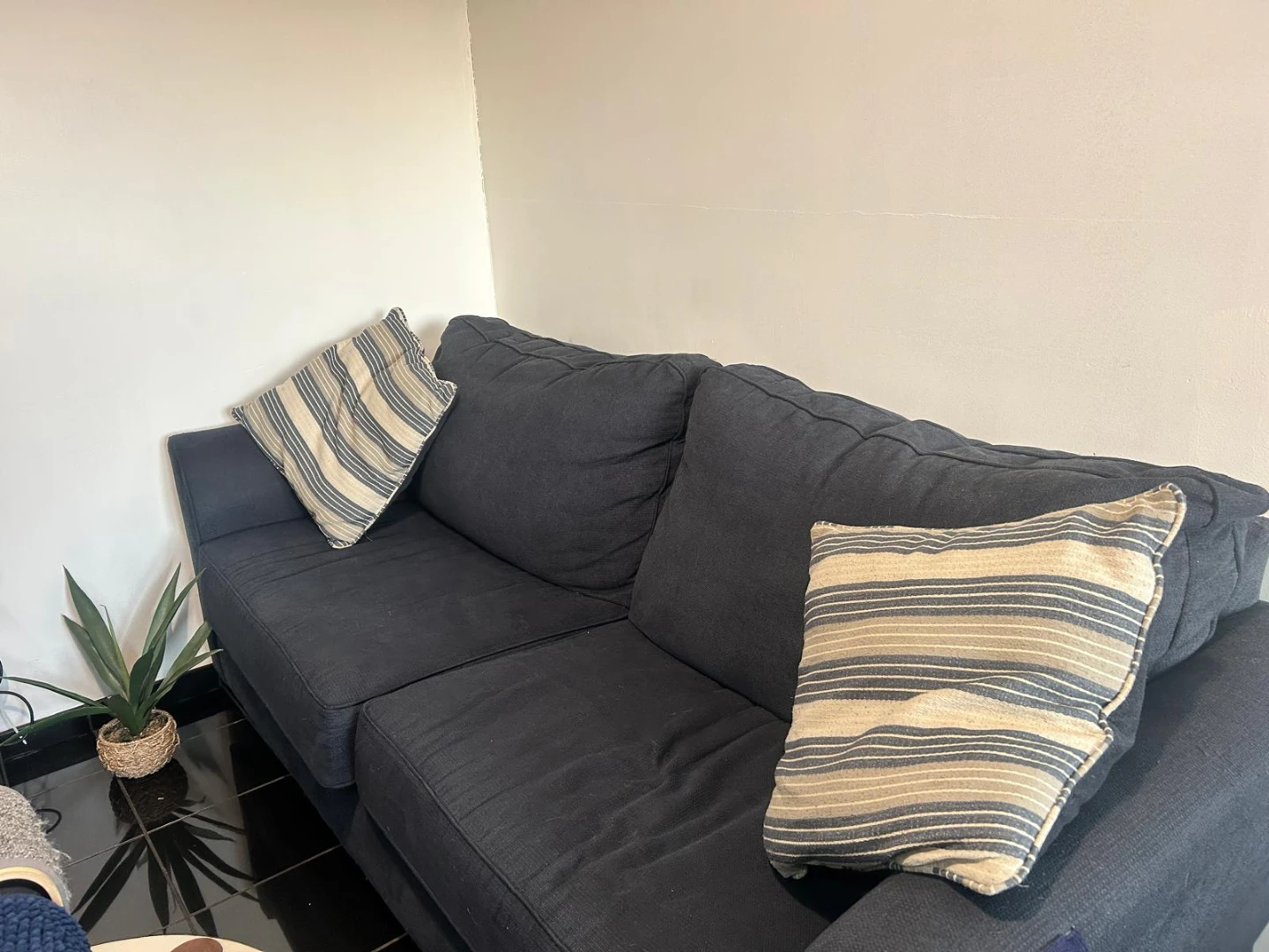 Dark Blue Sectional Couch with Striped Pillows - photo 2