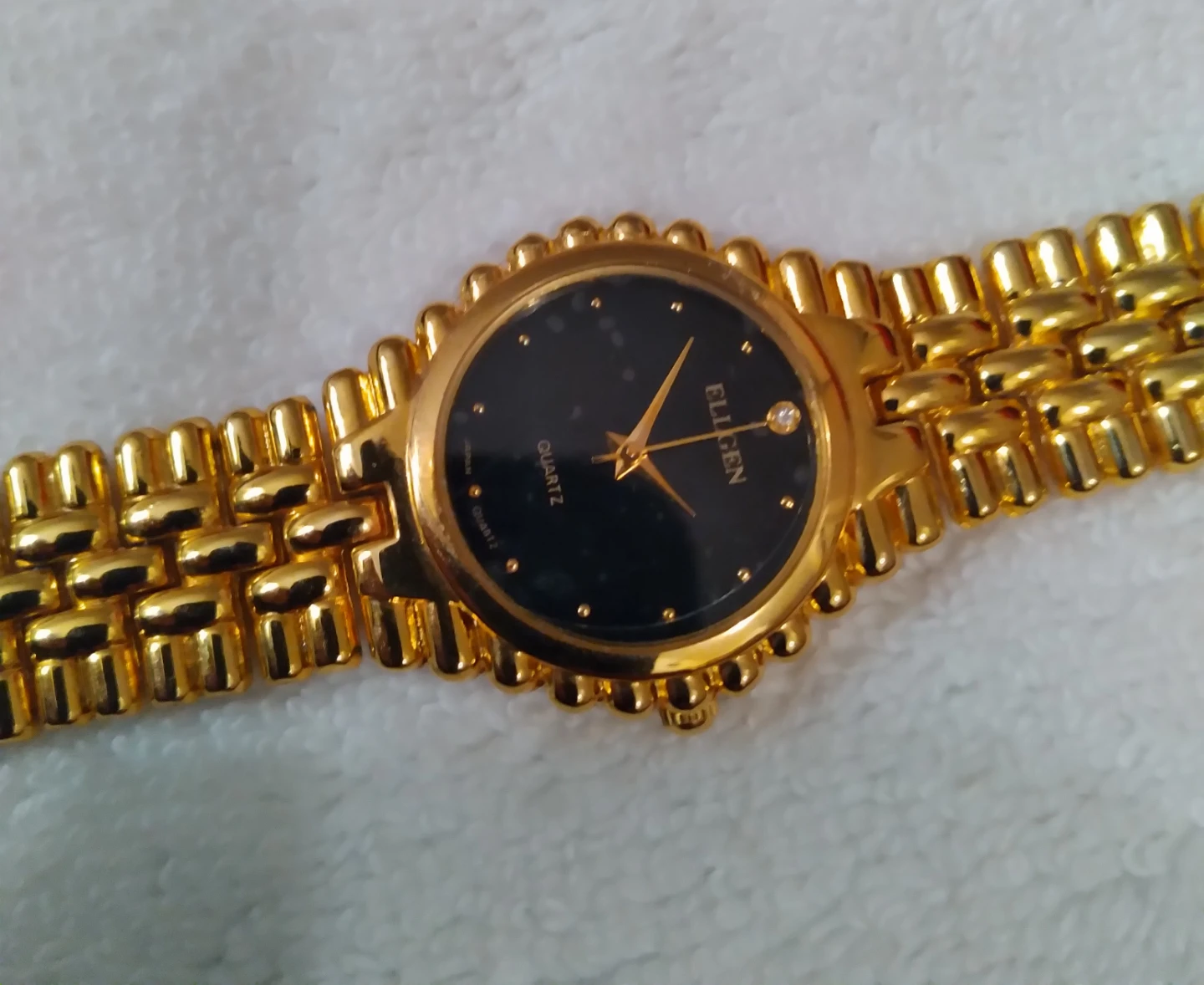 ELEGANT Gold Tone Quartz Watch with Black Face