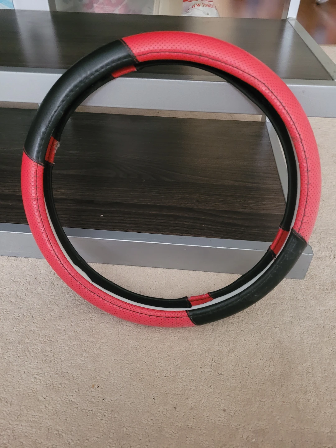 Red and Black Steering Wheel Cover - Damaged