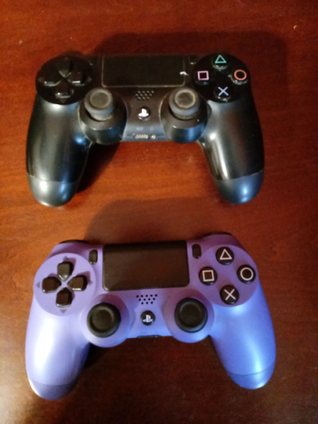 Two Sony PlayStation 4 DualShock 4 Controllers - Black & Purple