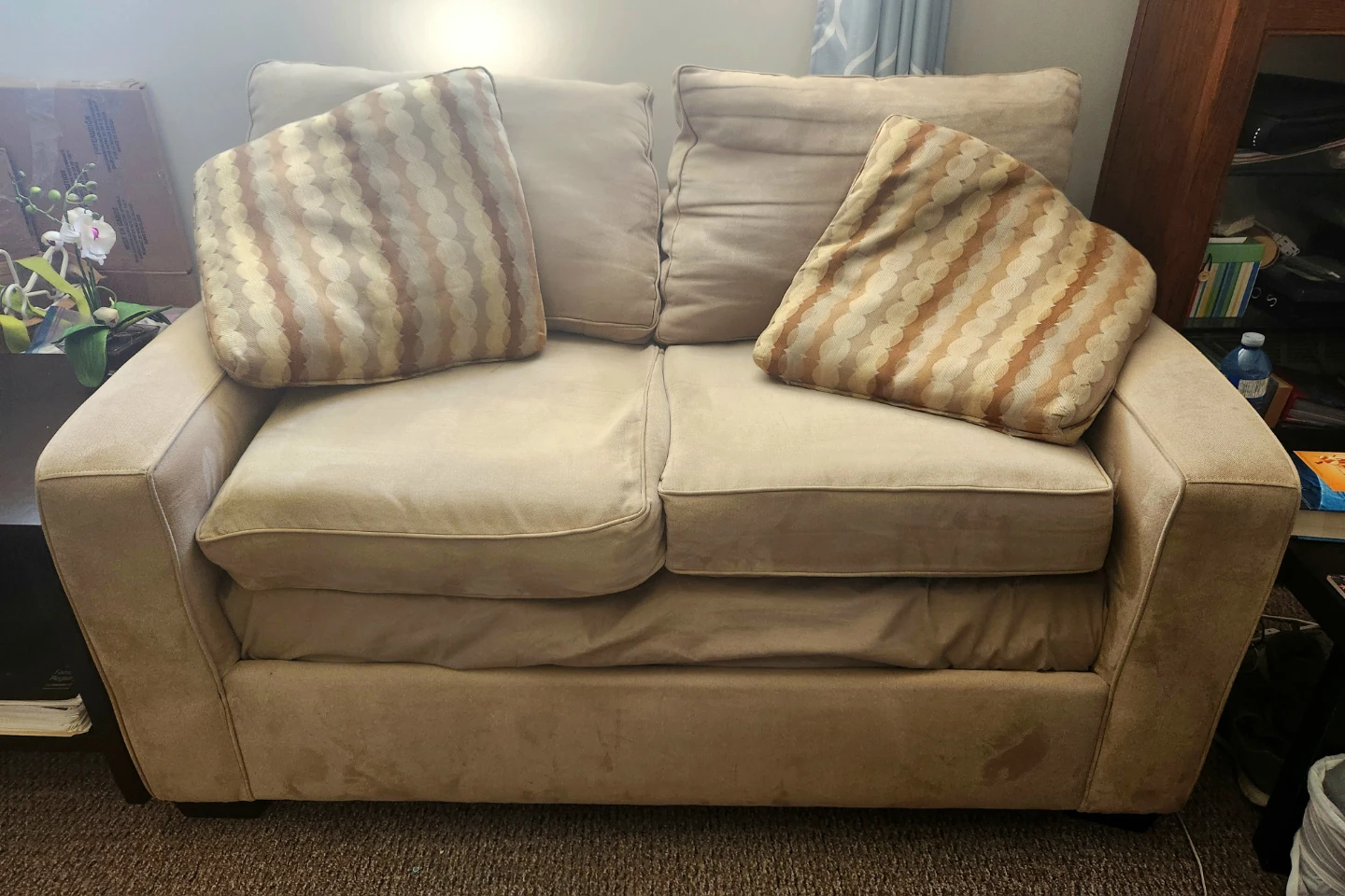 Beige Loveseat with Decorative Pillows