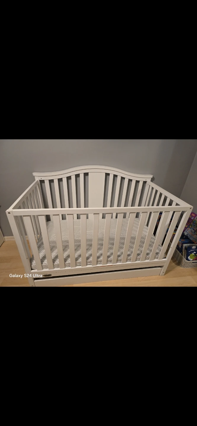 White convertible crib with drawer