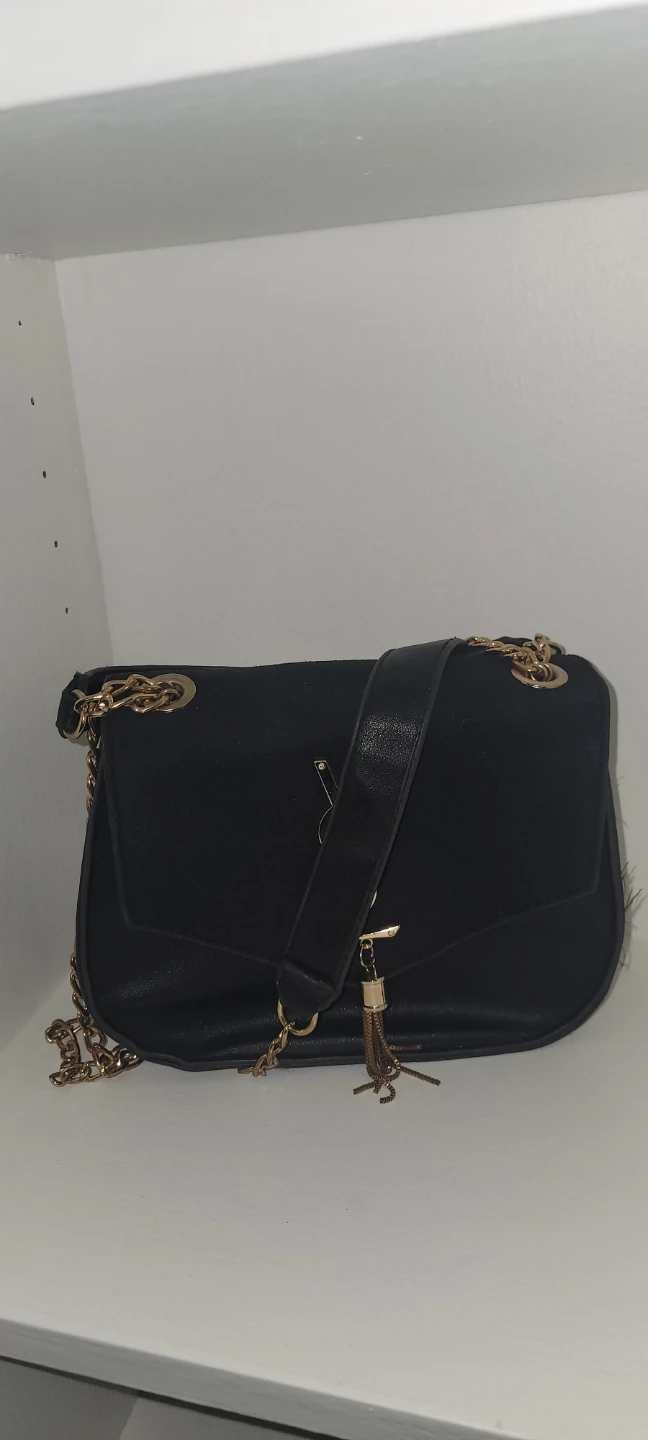 Black shoulder bag with gold chain