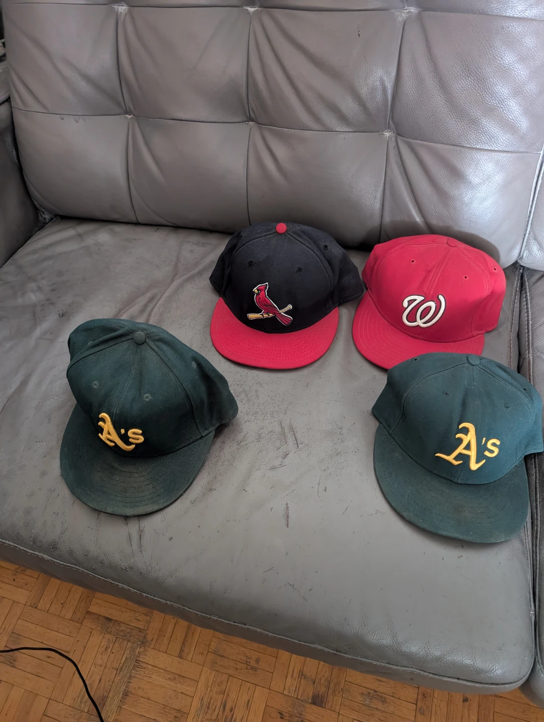 Assortment of 4 Baseball Caps