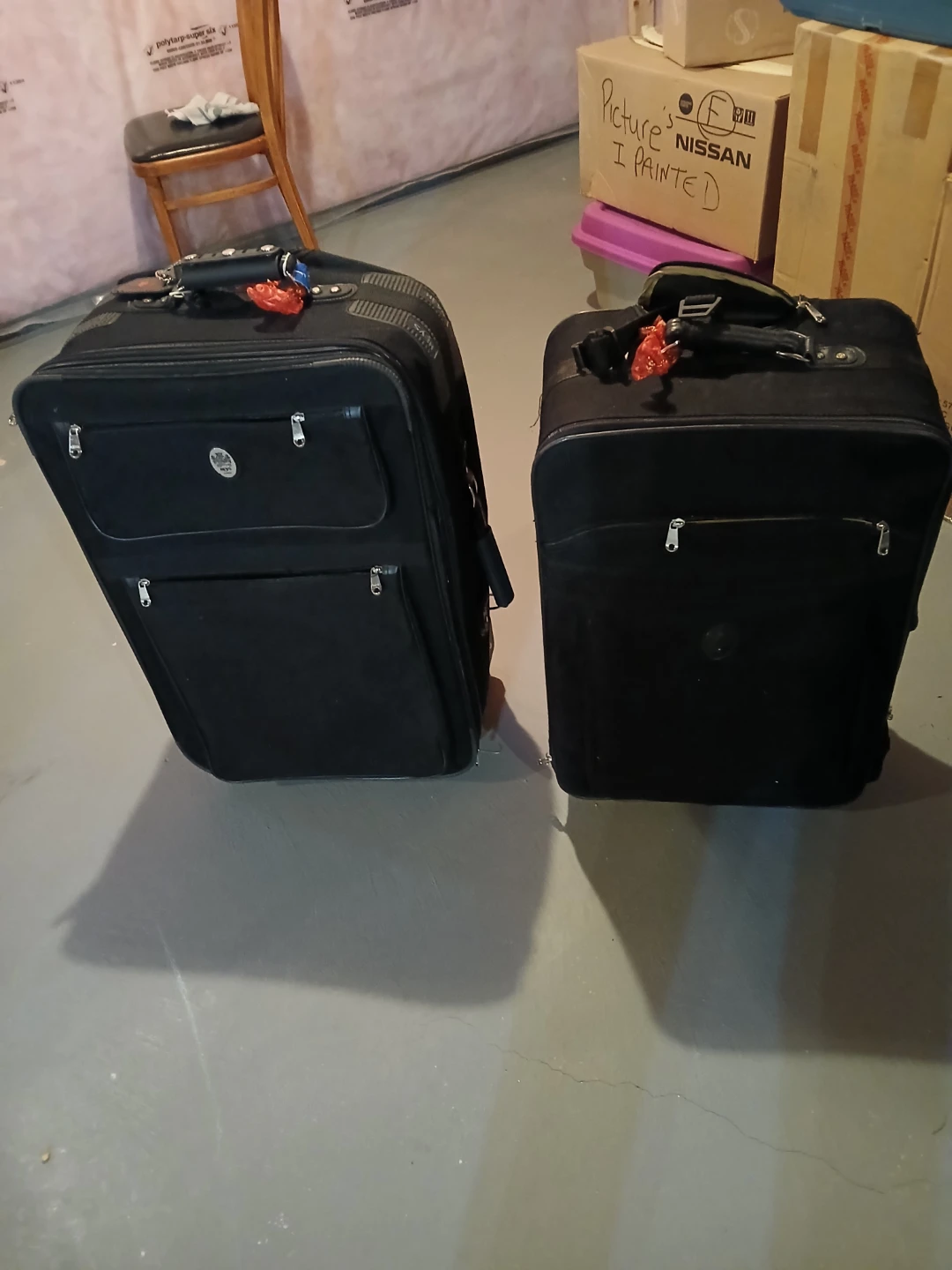 Two Black Softside Rolling Suitcases