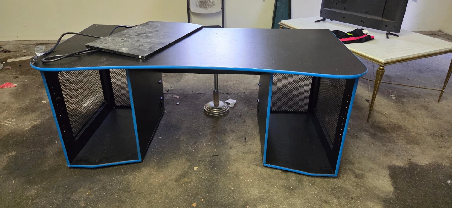 Black Gaming Desk with Blue Trim and Mesh Sides