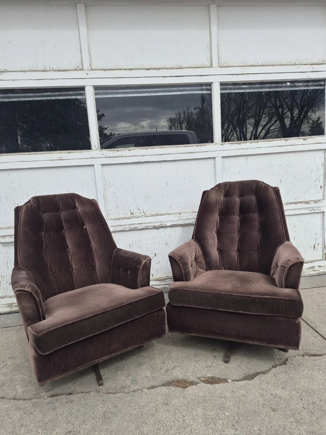 Pair of Brown Tufted Swivel Armchairs