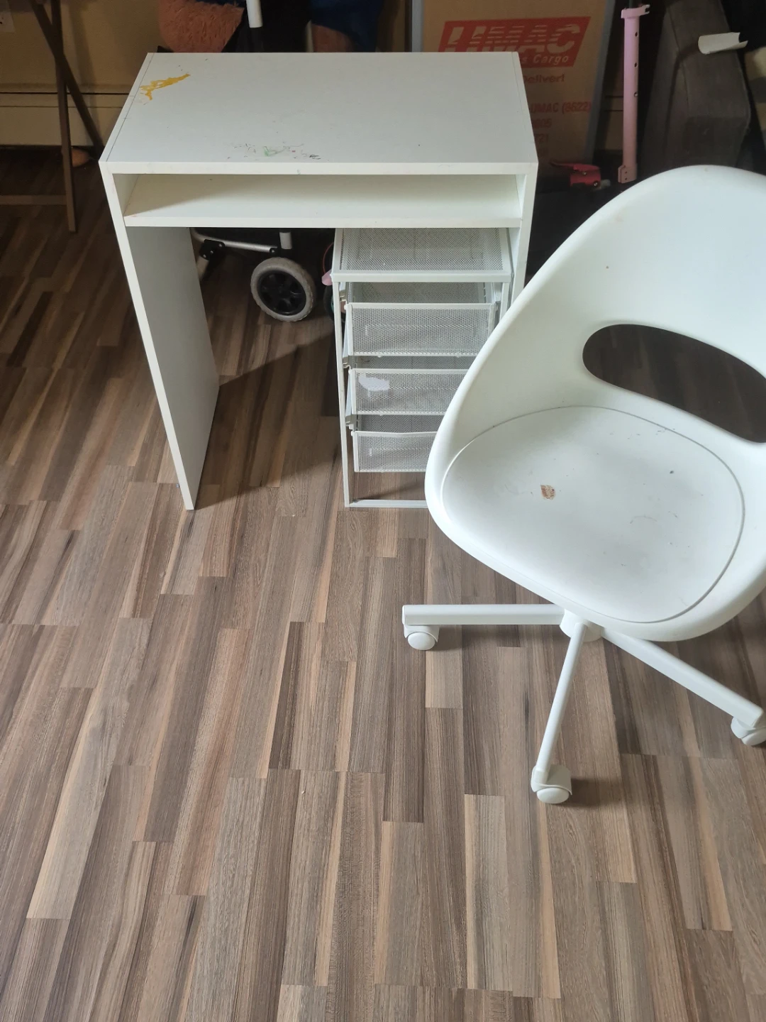 White desk with rolling drawers and chair