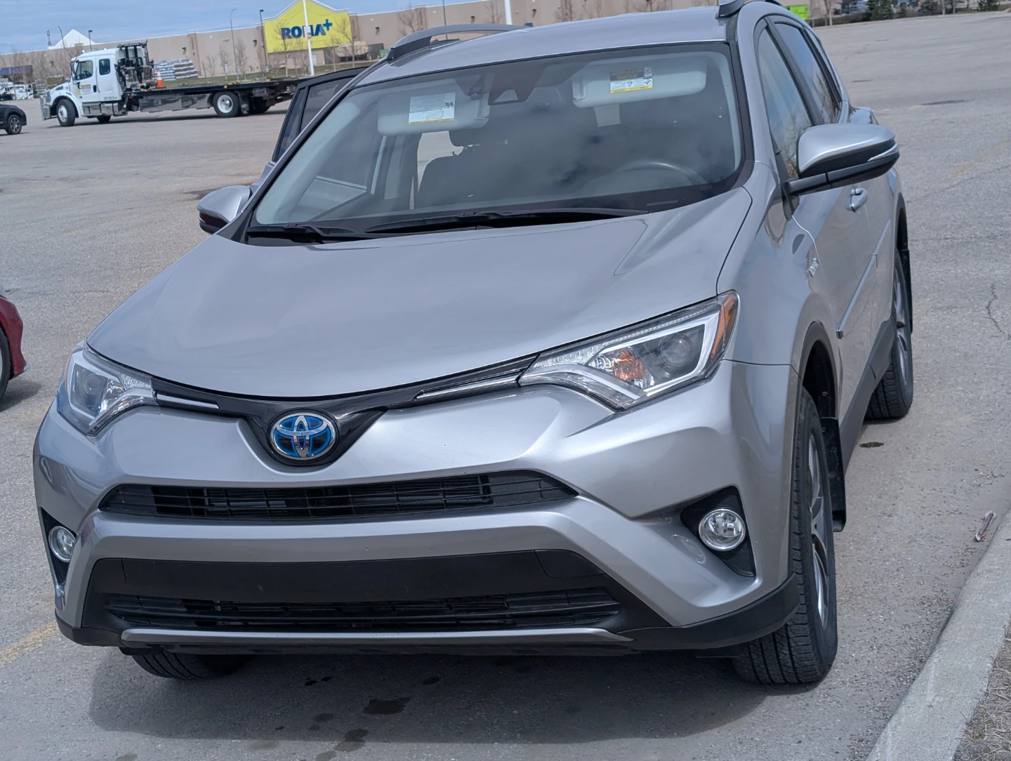 Silver Toyota RAV4 LE Hybrid SUV - photo 4