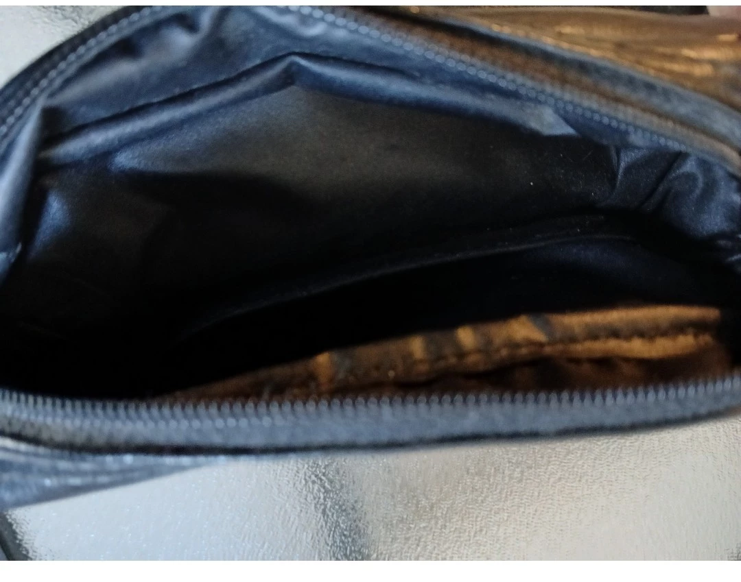 Black wristlet with embroidered 'S'. - photo 2