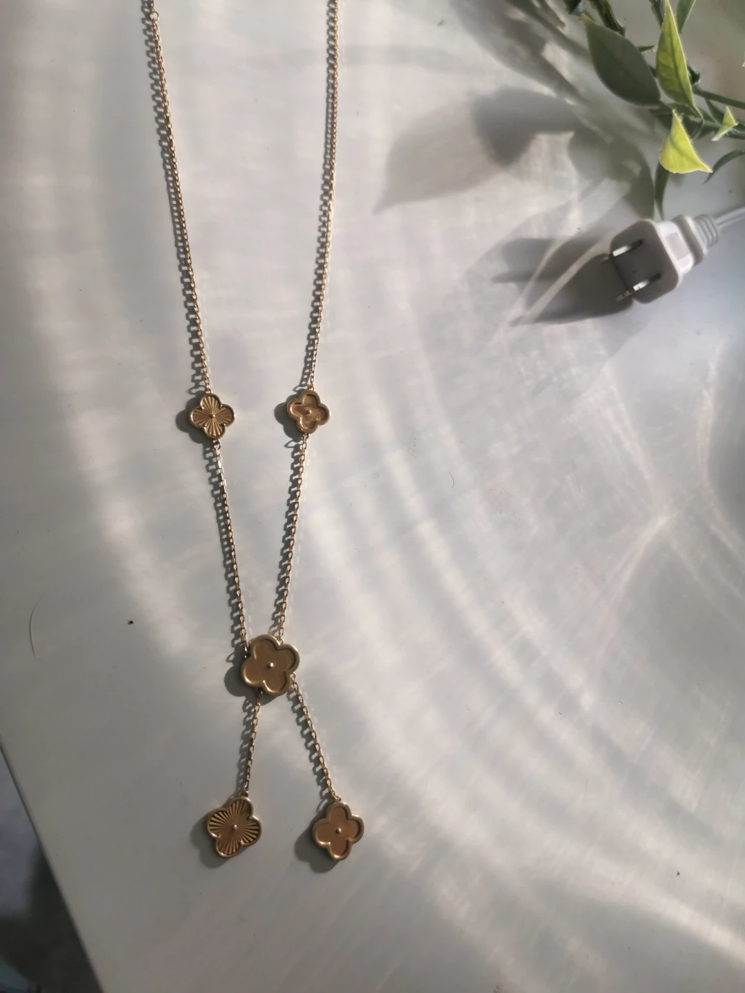 Gold-tone clover charm necklace