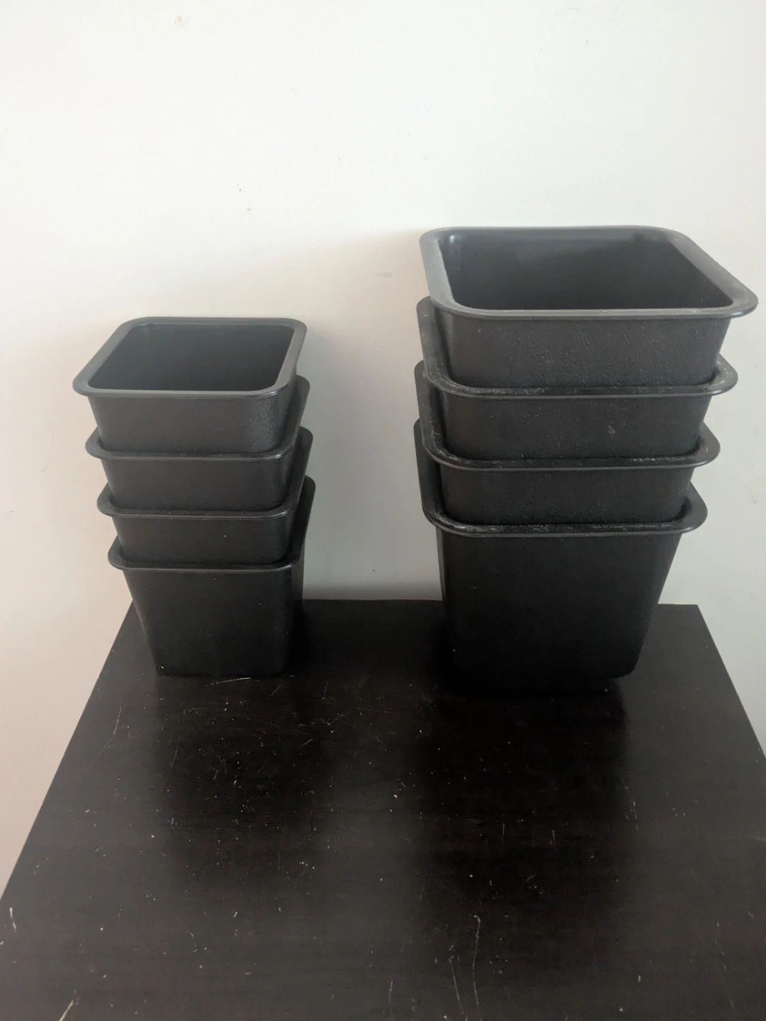 Stack of 7 Black Plastic Square Pots