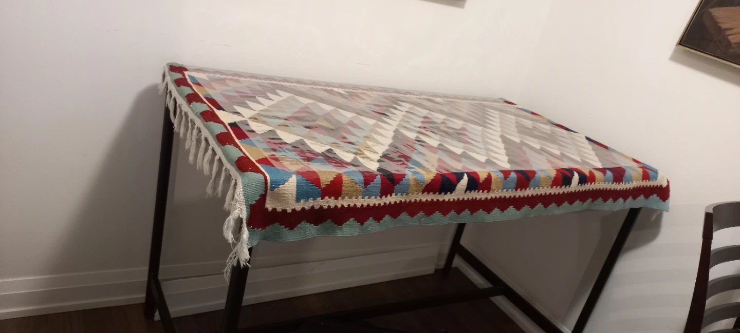 A table with a Decorative Table Runner with Tassels