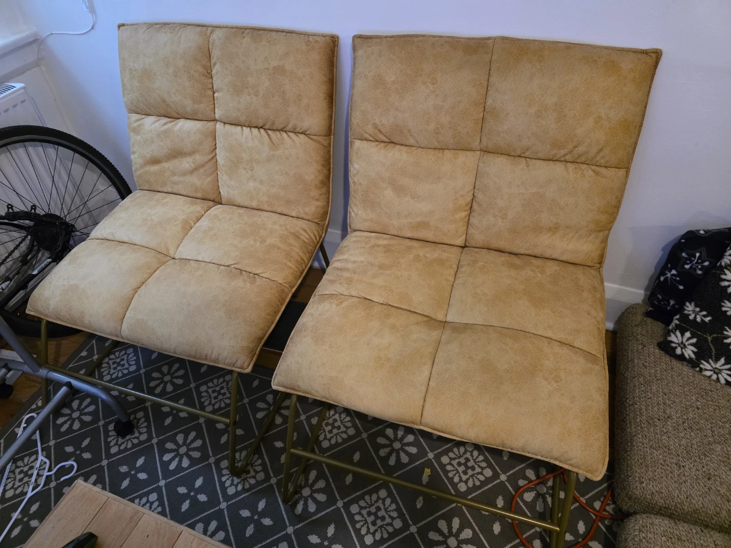 Pair of tan faux leather accent chairs
