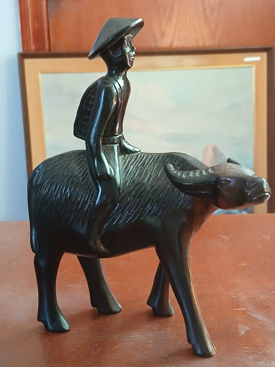 Carved Wooden Figurine of Man Riding Water Buffalo