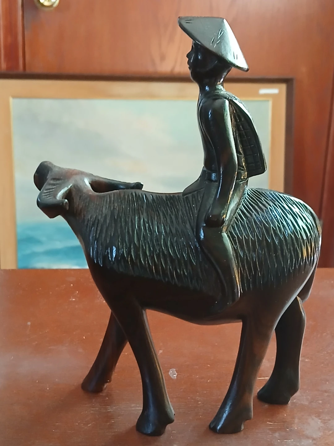 Carved Wooden Figurine of Man Riding Water Buffalo - photo 2
