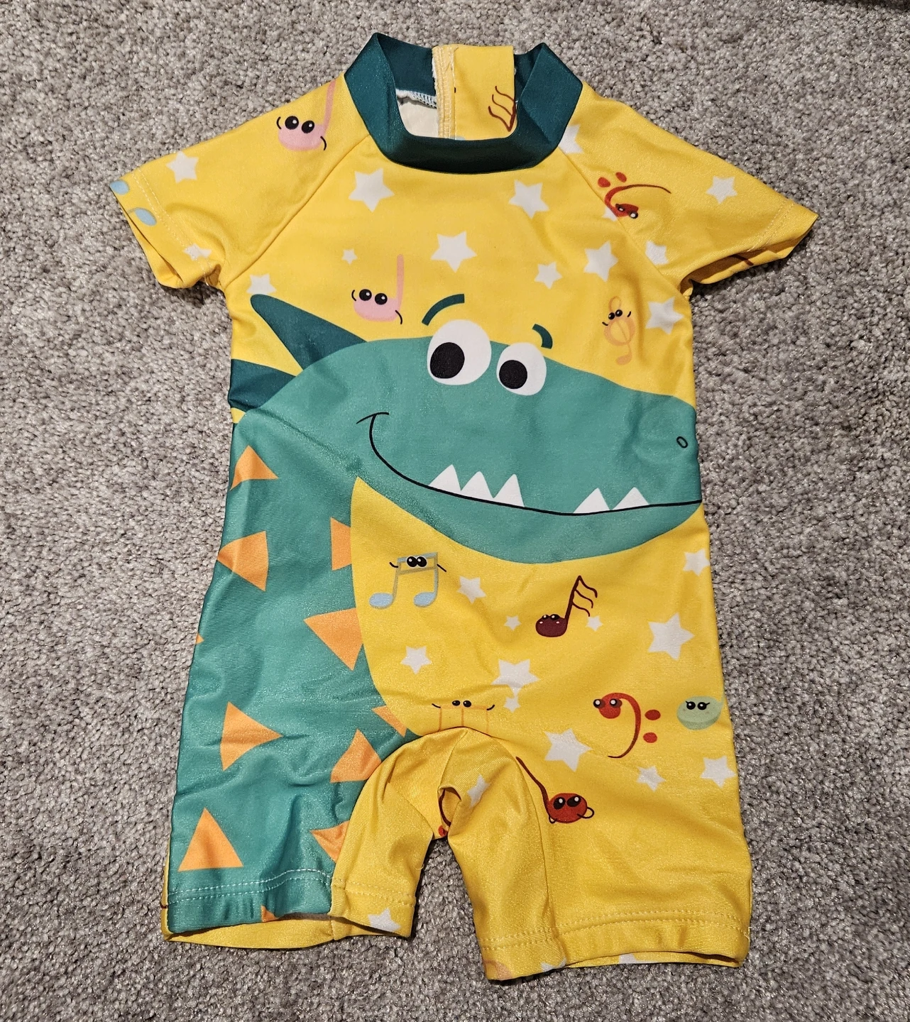 Dinosaur Swimsuit with music notes