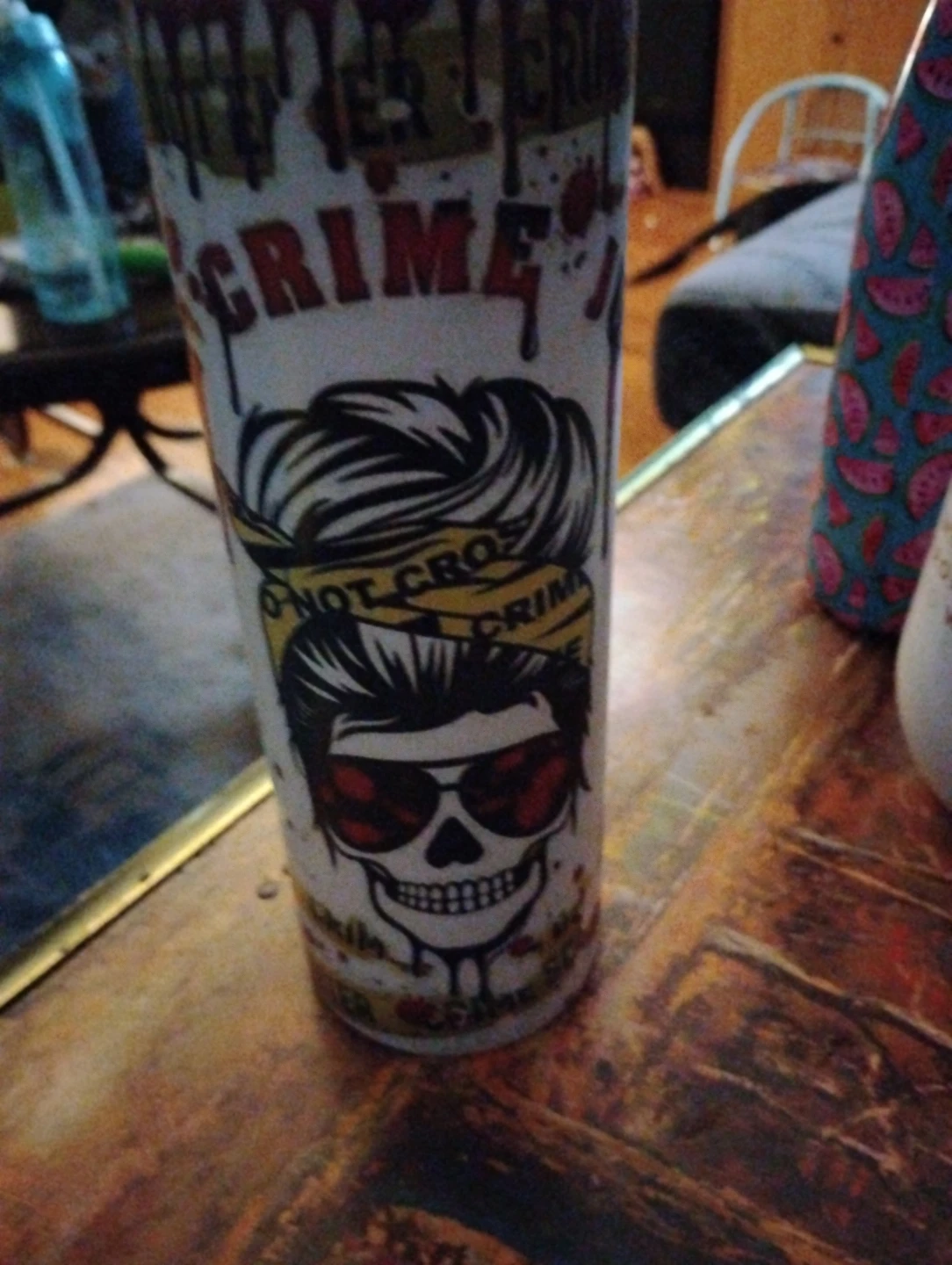 Tumbler with 'Crime Doesn't Pay' Skull Graphic