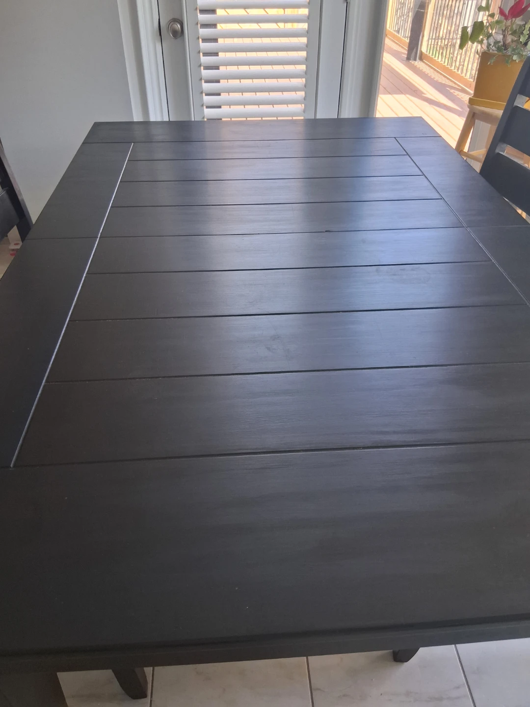 An Extendable Black Dining Table with 4 Padded Chairs - photo 2