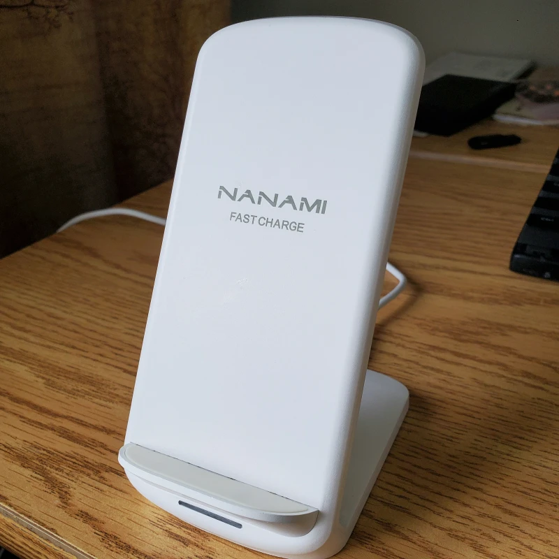 White wireless phone charging stand and cable
