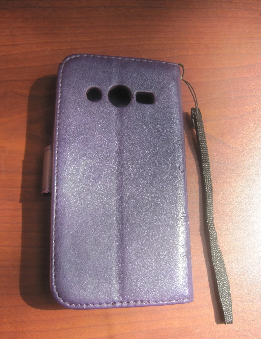 Purple Embossed Butterfly Flip Phone Case w/Strap. Pick up only. - photo 2