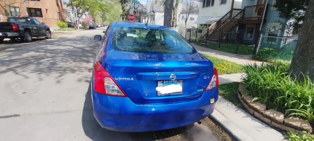 Blue Nissan Versa SV Sedan - photo 3