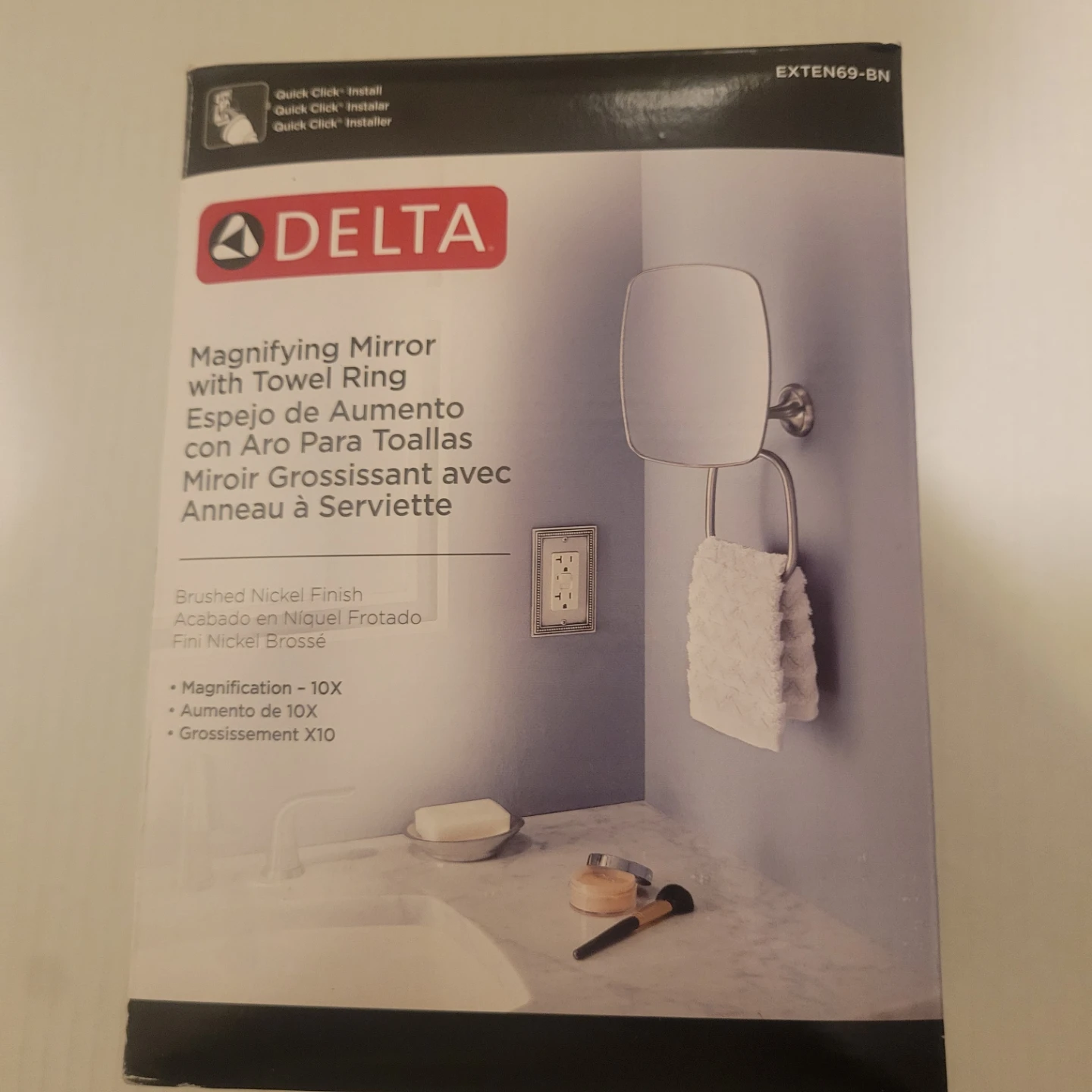 Delta Magnifying mirror with towel ring