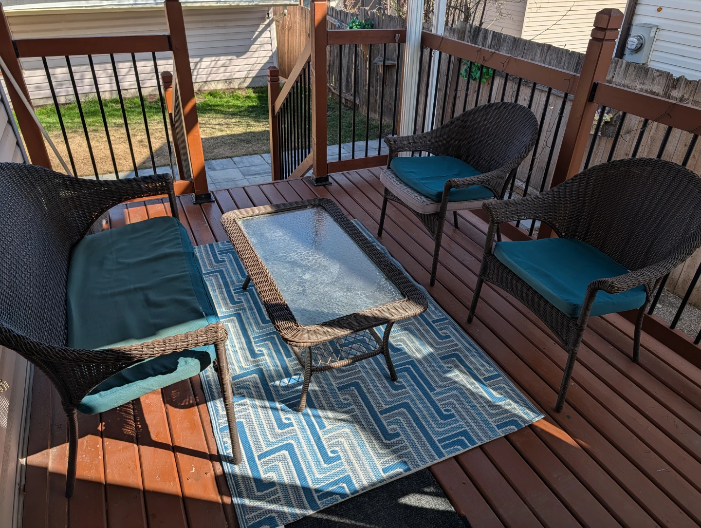 Wicker patio set with glass top table