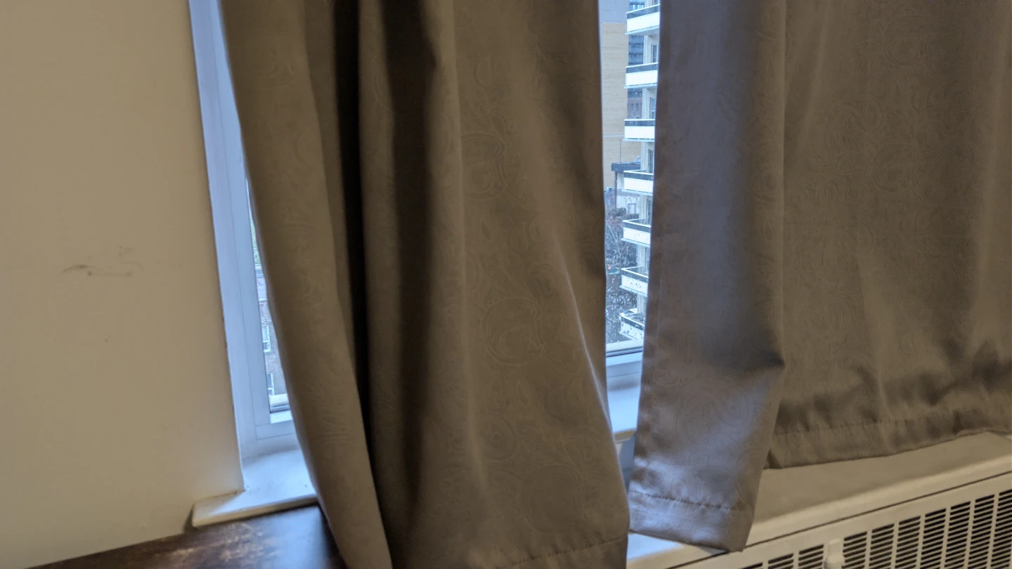 Grey patterned grommet curtains