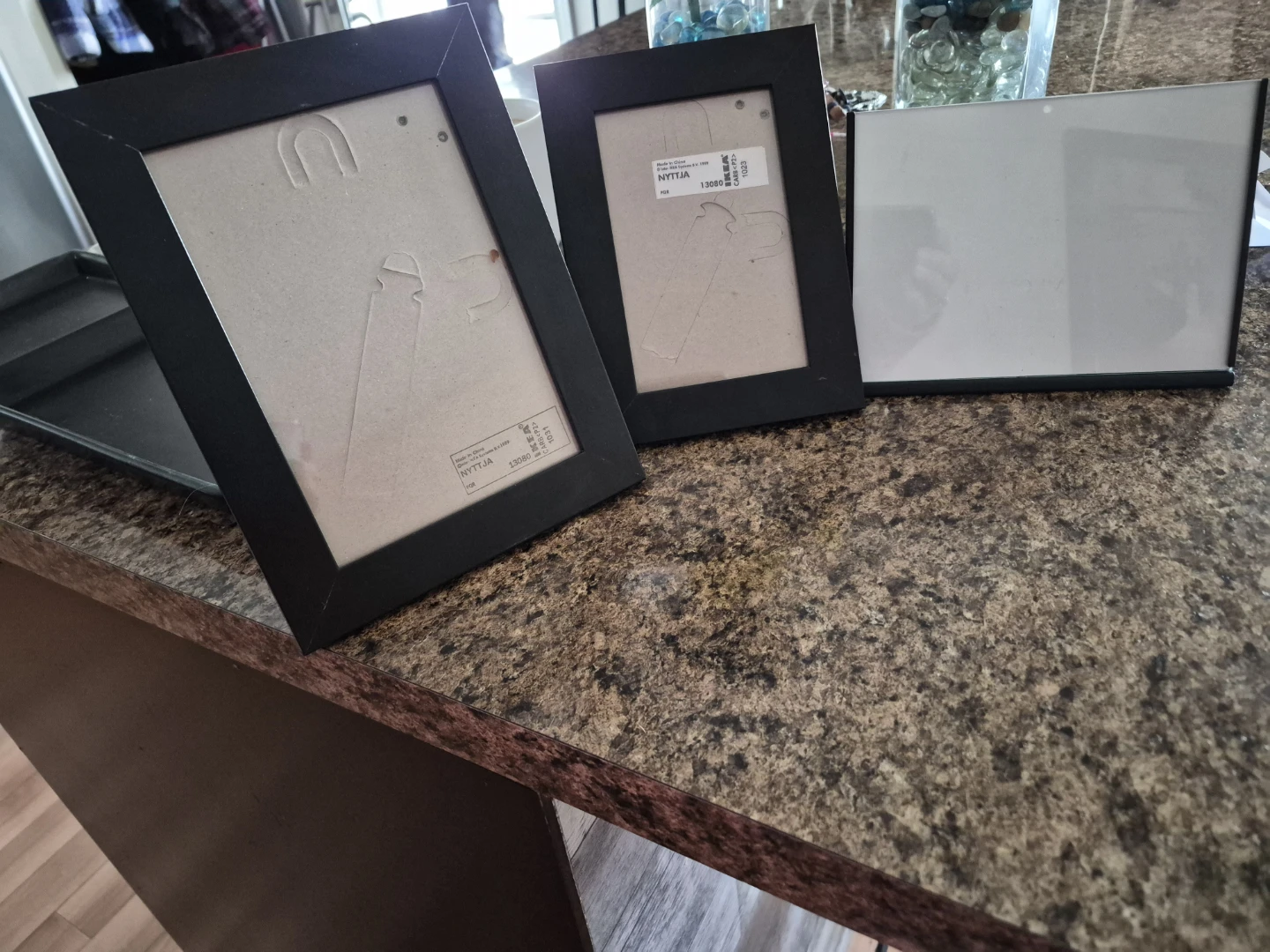 2 Ikea Black Picture Frames and a Metal Picture Frame