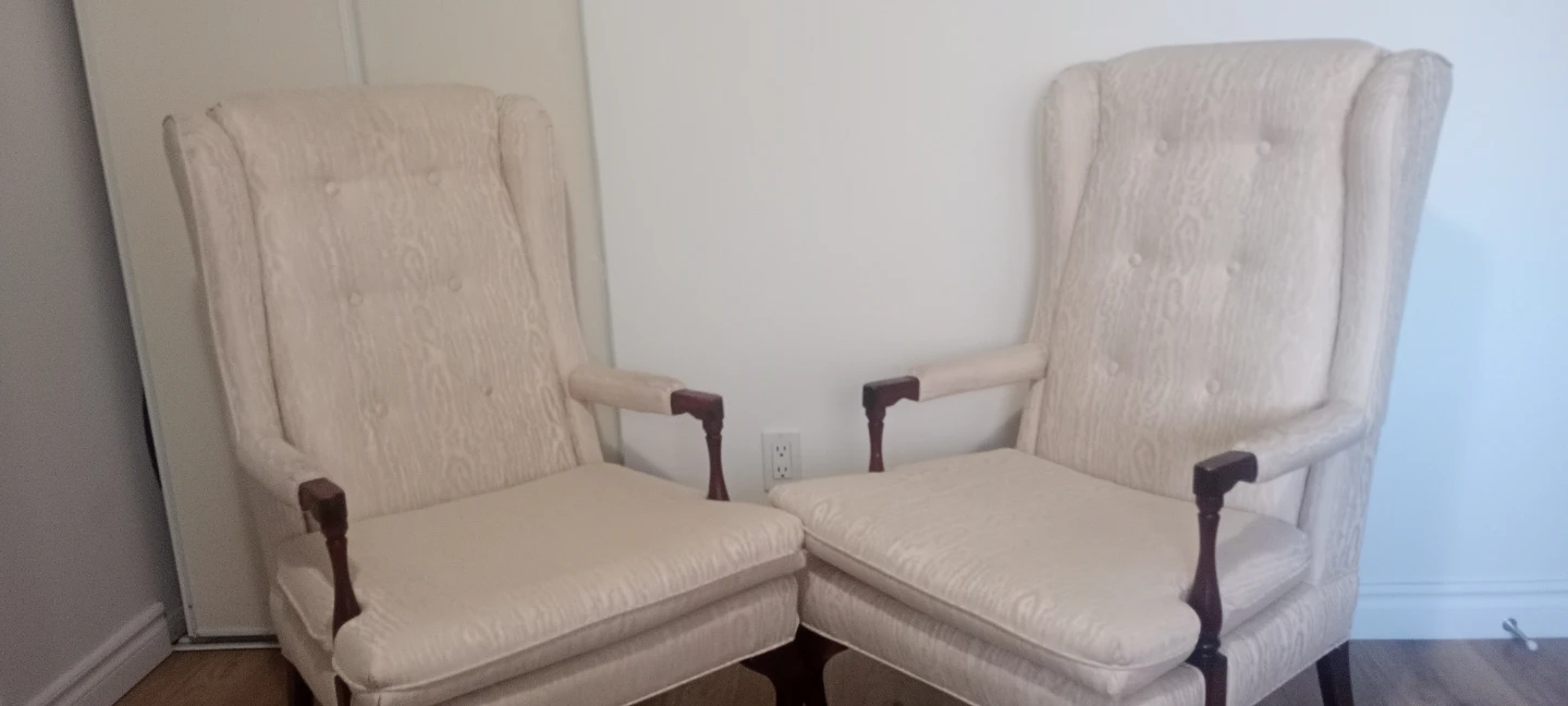 Pair of Cream Upholstered Wingback Chairs