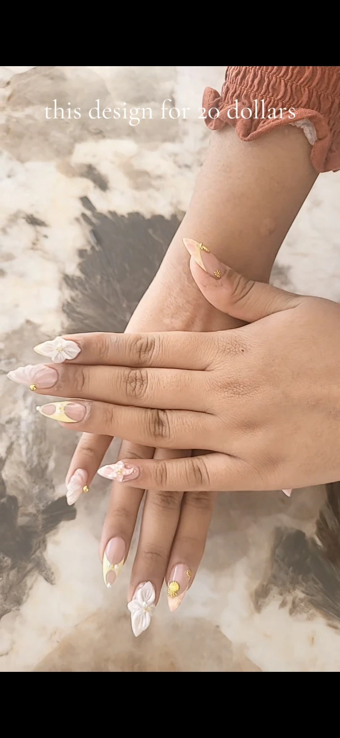 Nail Art Design with 3D Flowers and Gold Accents