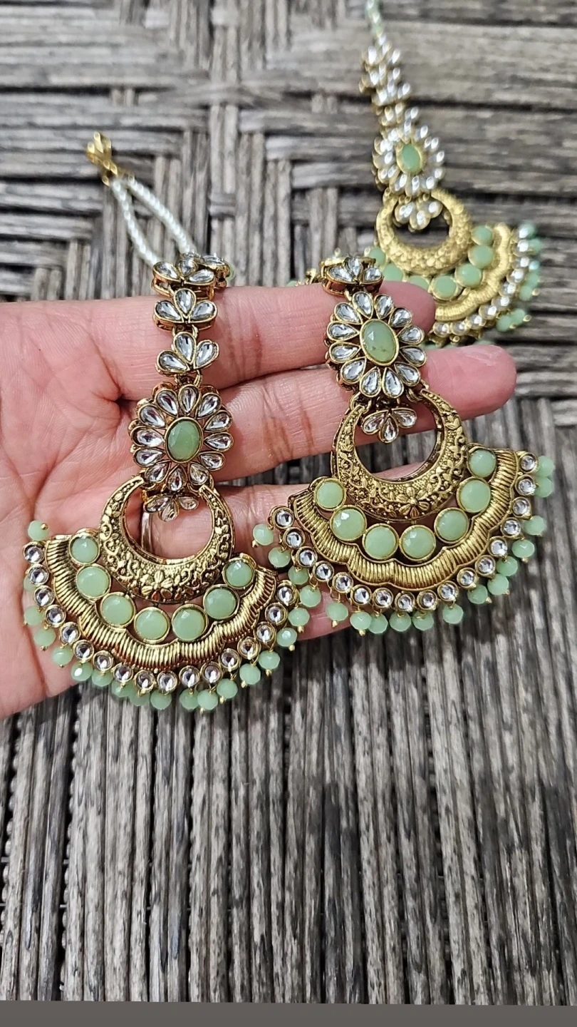 Gold-tone mint green beaded chandelier earrings 🌱