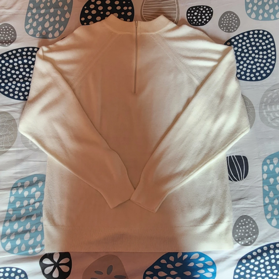 Cream coloured half-zip sweater