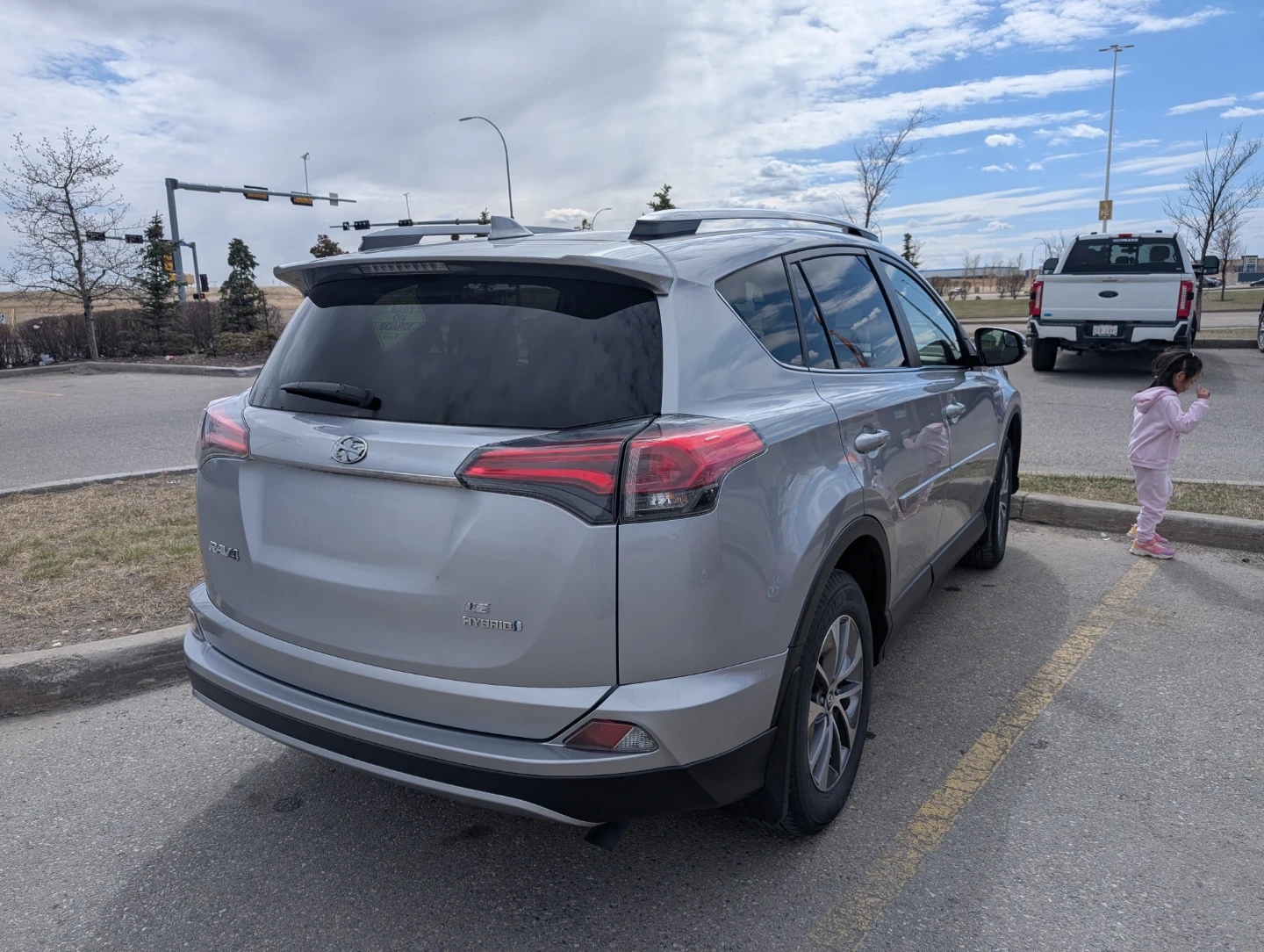 Silver Toyota RAV4 LE Hybrid SUV - photo 5