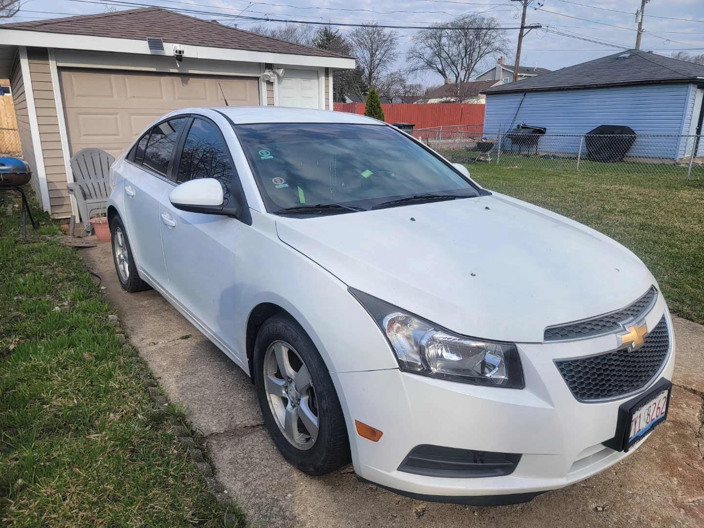 White Chevrolet Cruze with Neon Green Accents