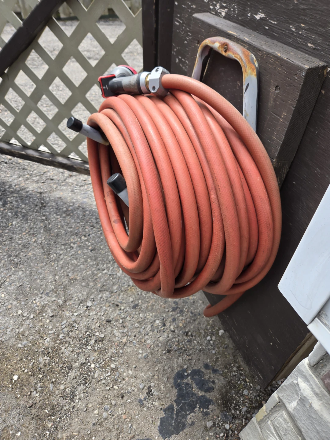 Orange Garden Hose with Spray Nozzle