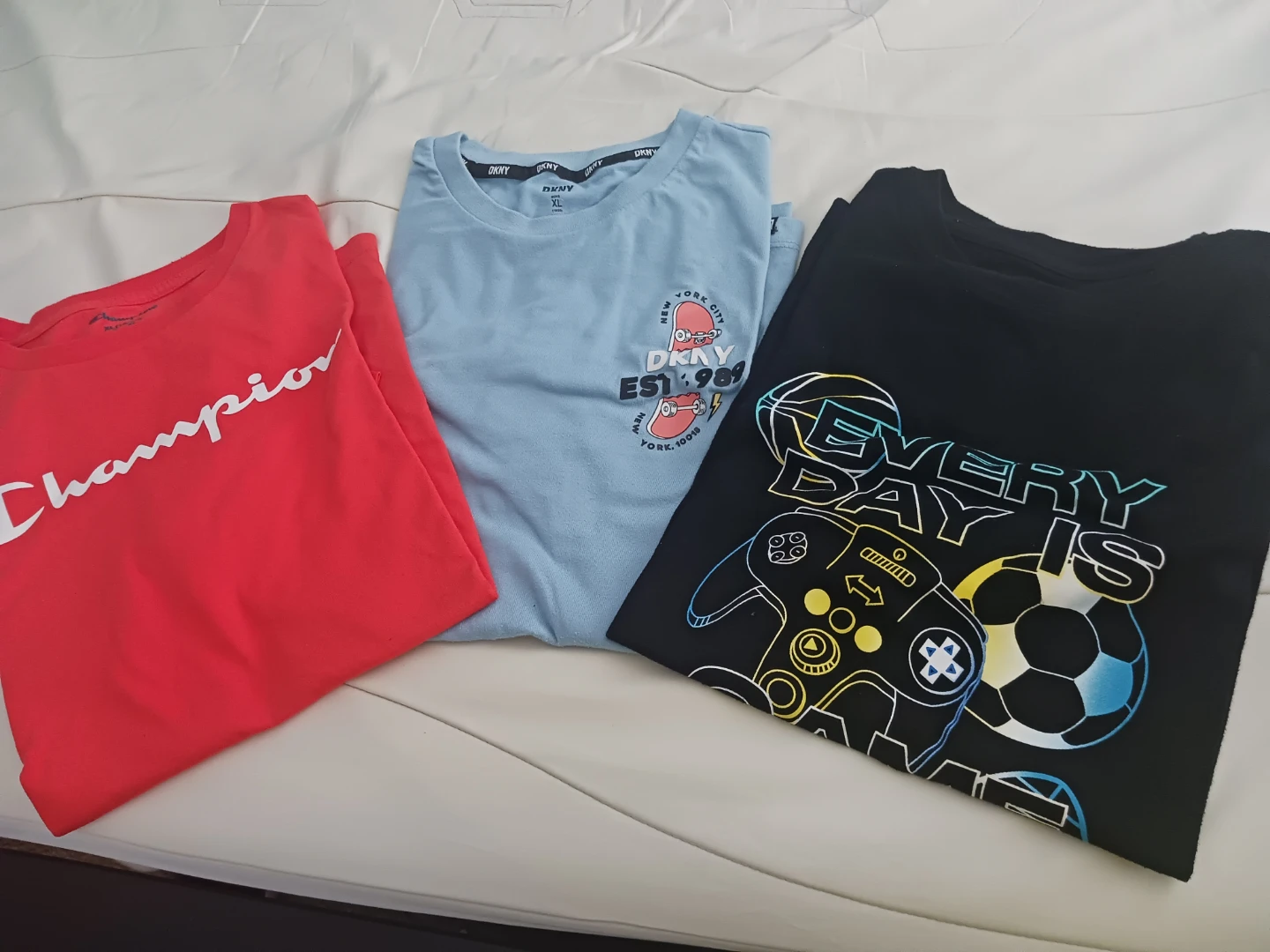 Champion, DKNY, and Black Graphic T-Shirts - Bundle of 3