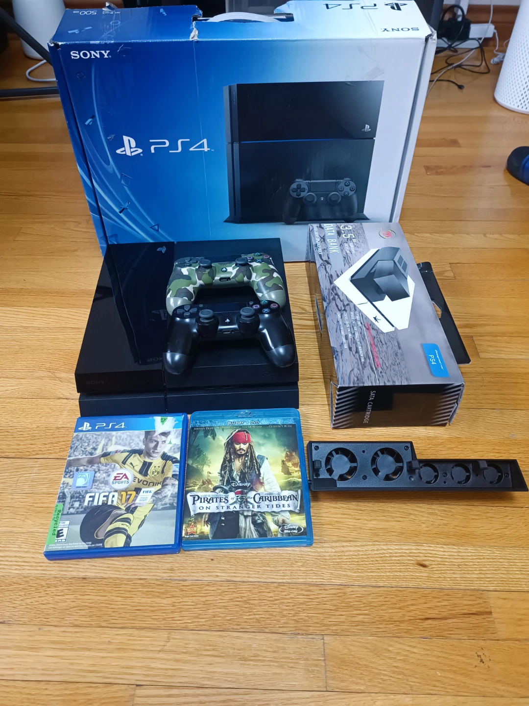 Sony PlayStation 4 gaming console in black with many accessories
