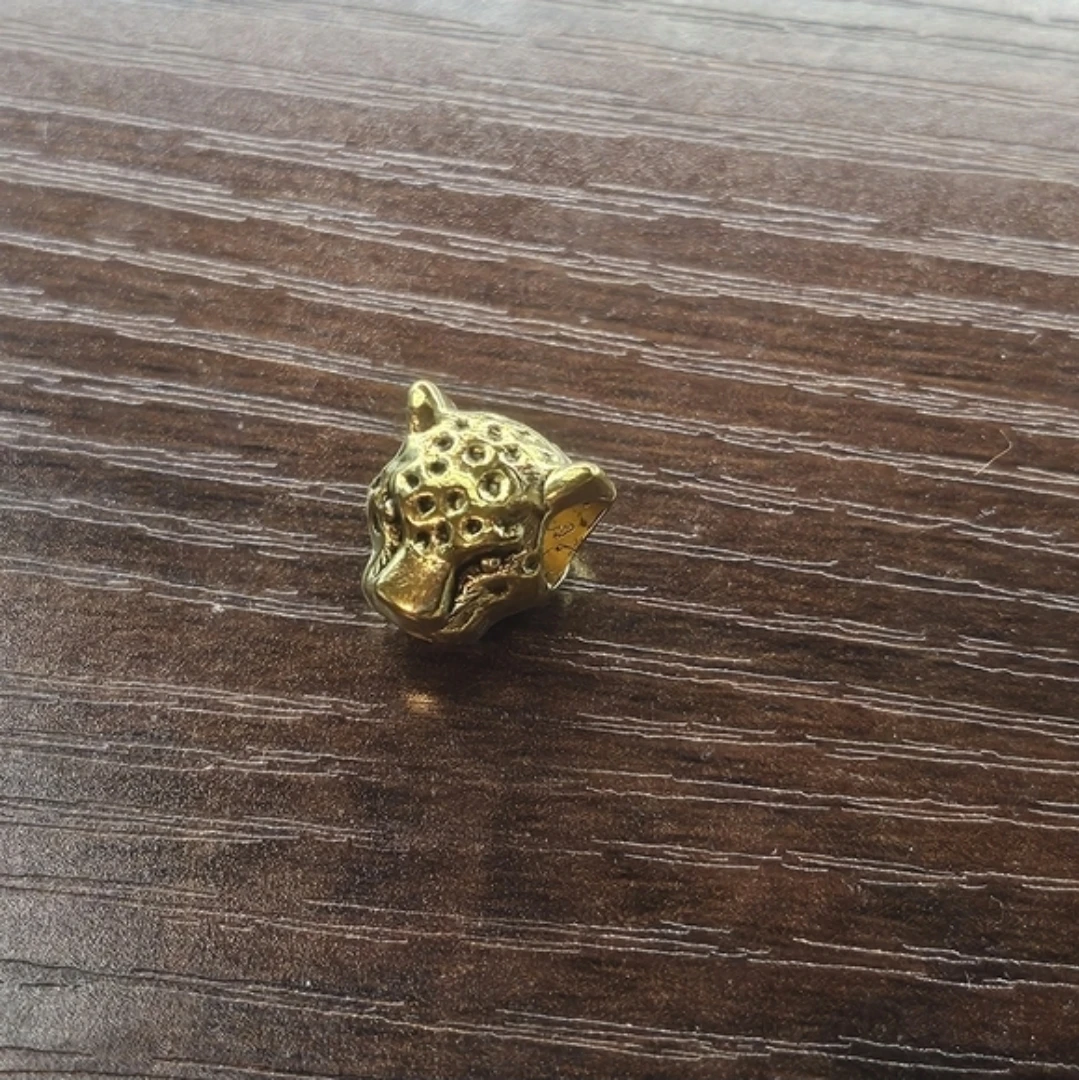 Gold coloured leopard head charm