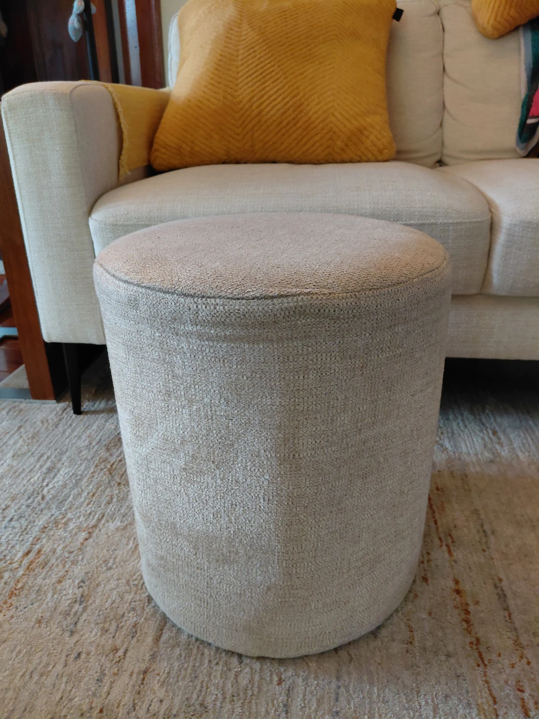 Round upholstered ottoman