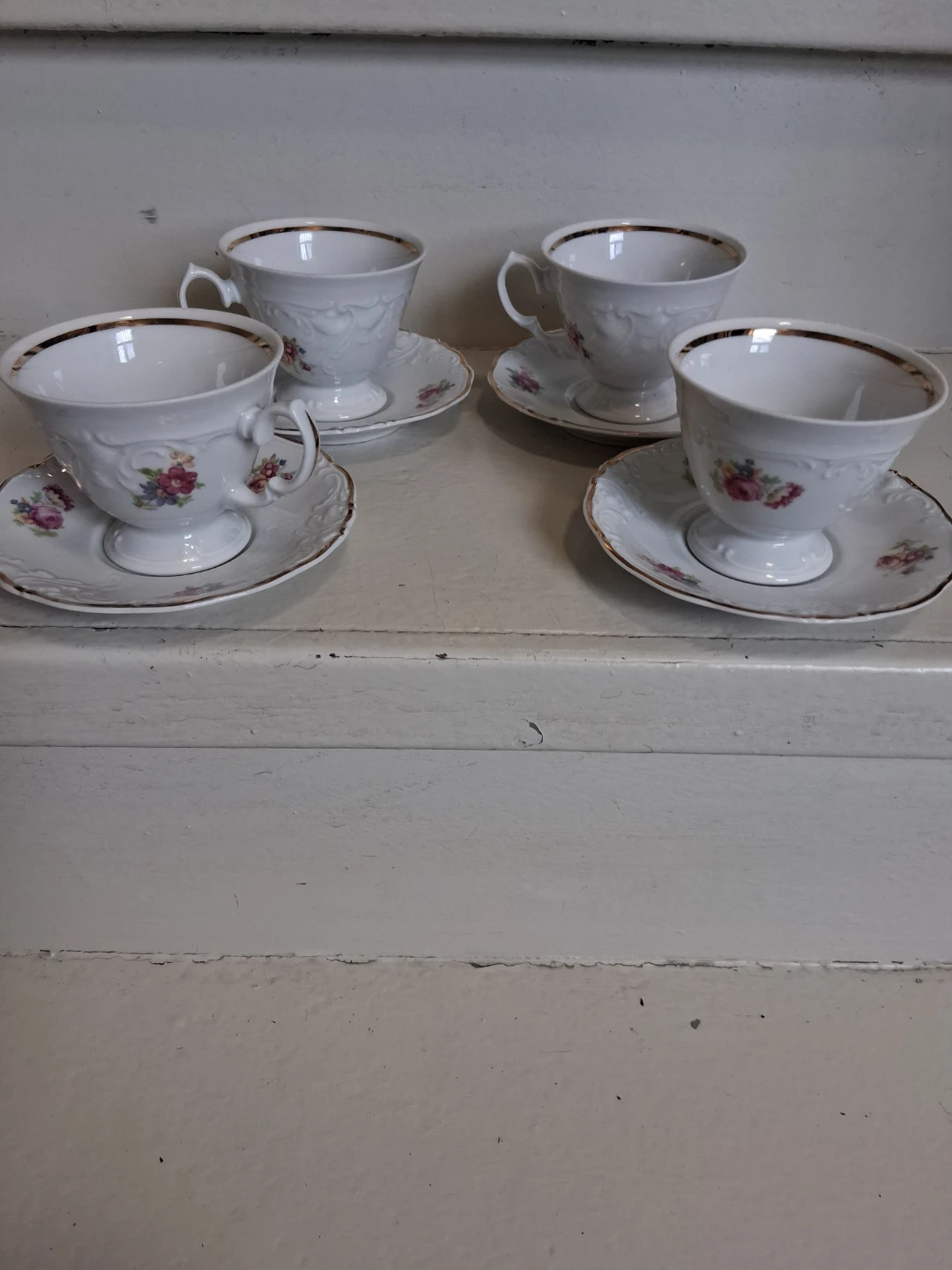Set of 4 White Floral Teacups and Saucers with Gold Trim