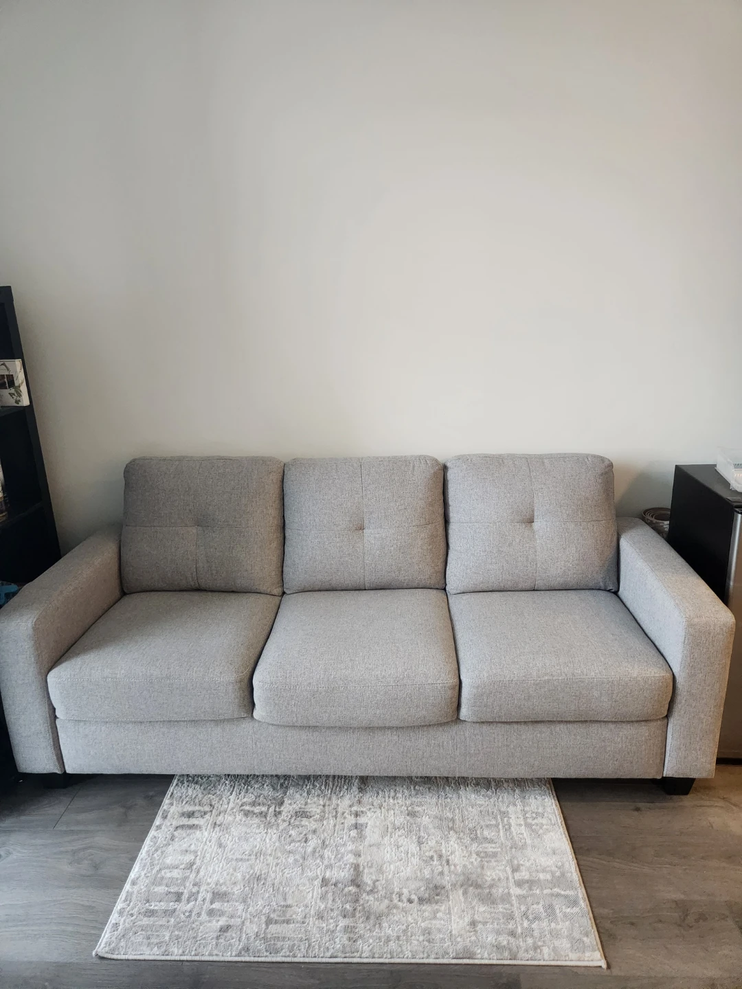 Grey three-seater sofa