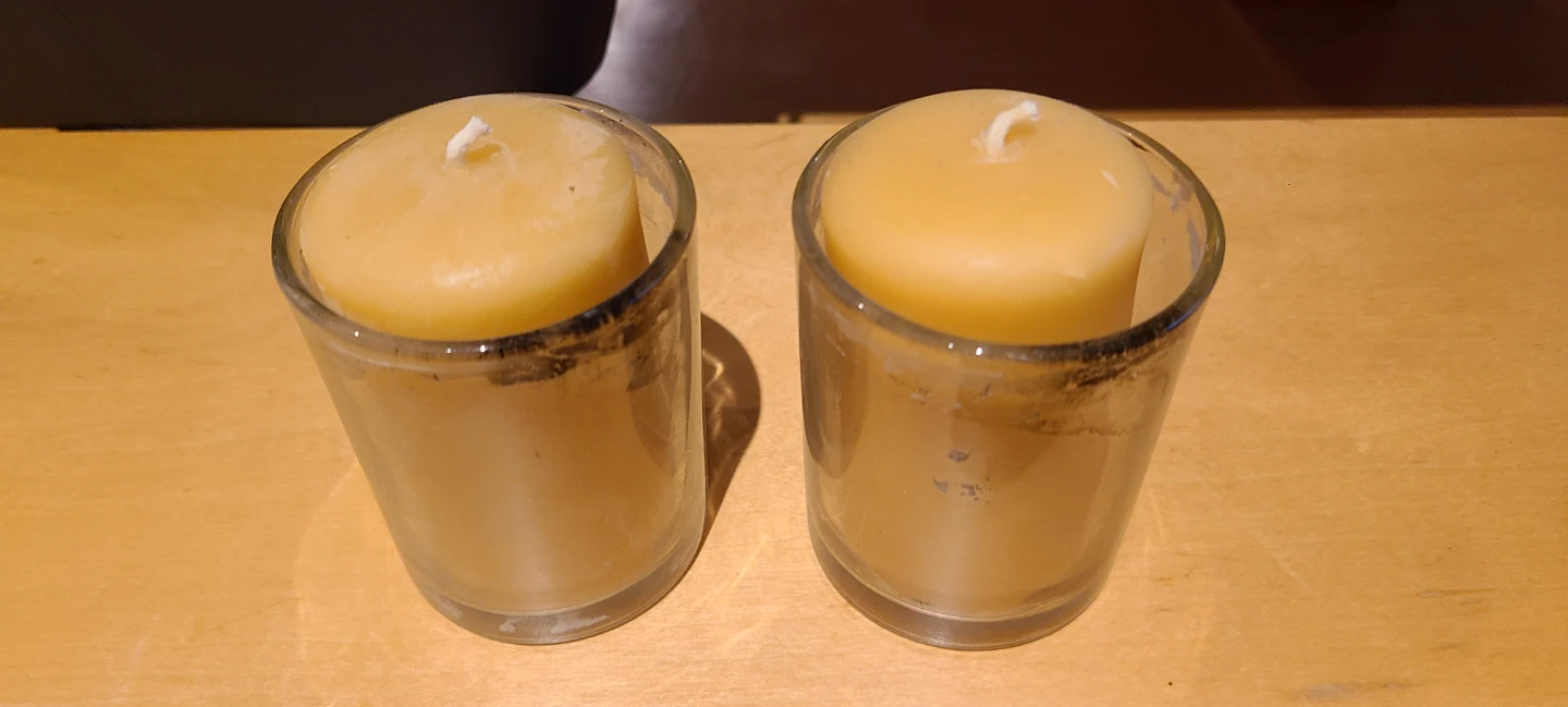 Two glass votive candles