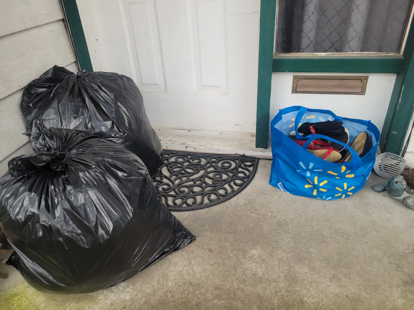 Black Garbage Bags and Walmart Reusable Bag with Shoes