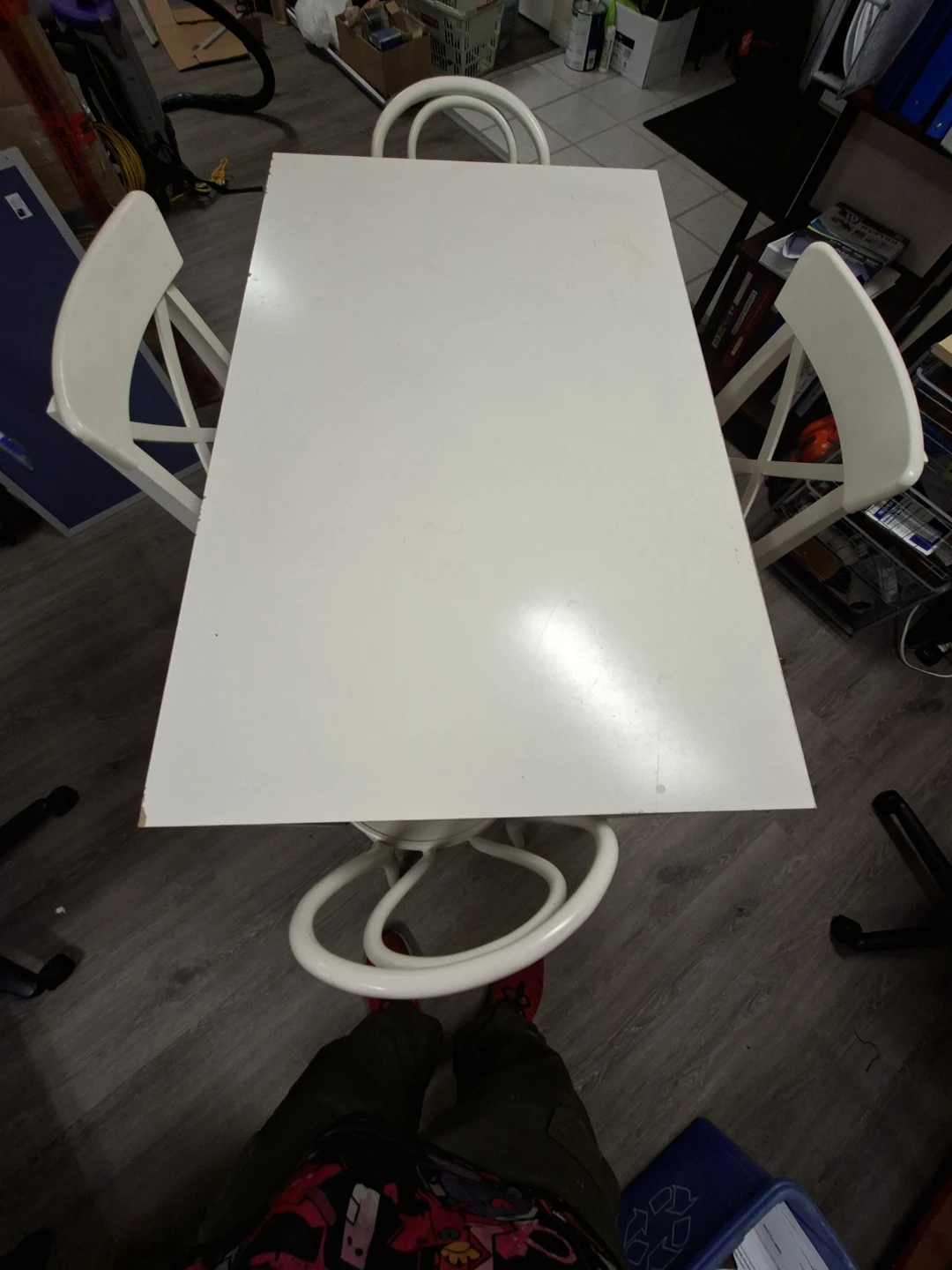 IKEA white dining chairs with pink plaid cushions