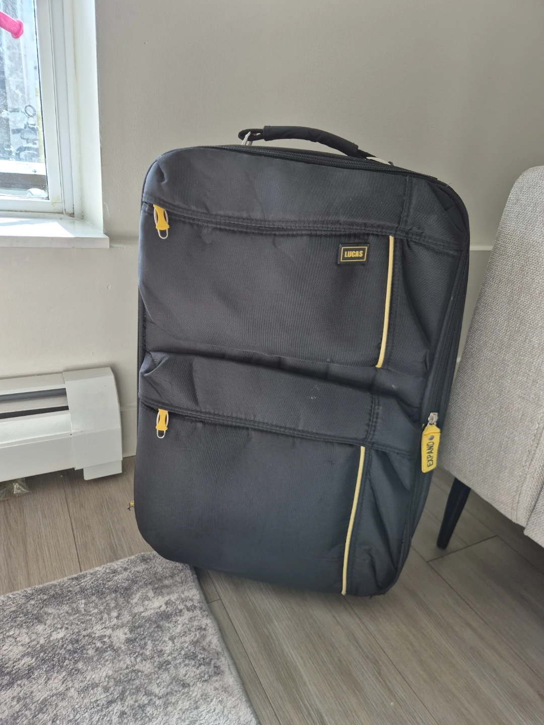Lucas Expandable Black Rolling Suitcase Carry-on
