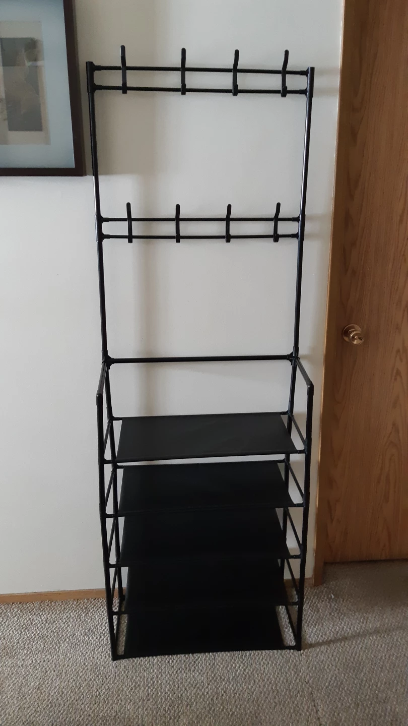 Black coat and shoe rack