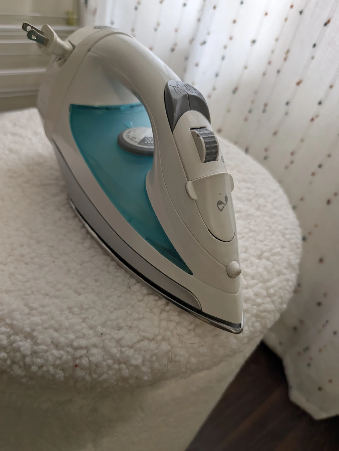 White and Teal Steam Iron